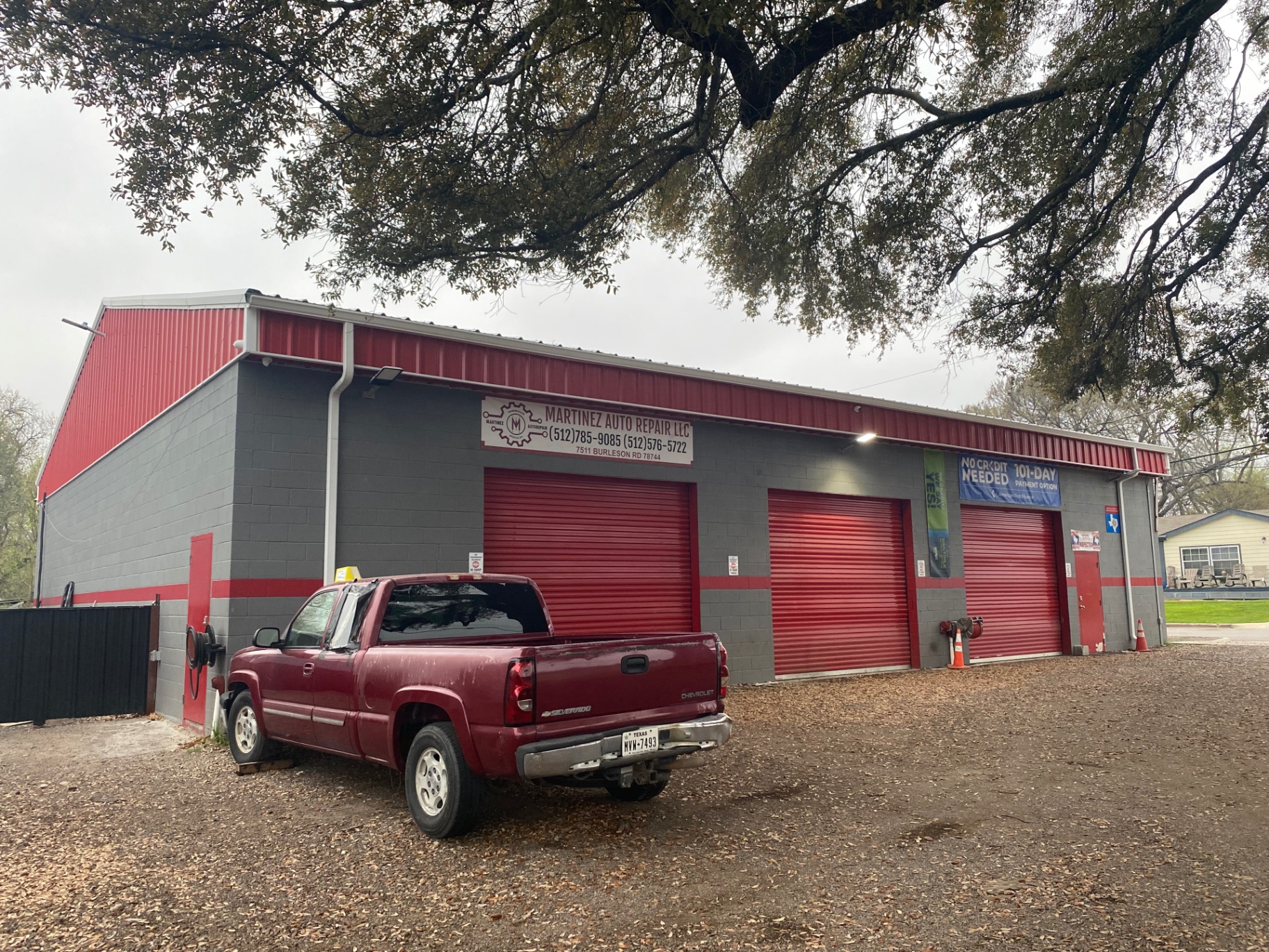 Commercial shop building we painted in gray with red accents