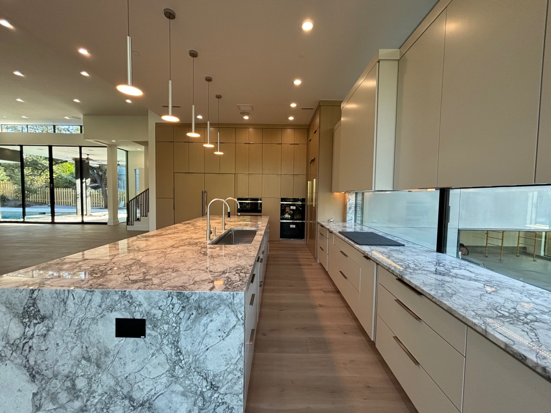 Modern kitchen we painted with a marble island and custom cabinetry